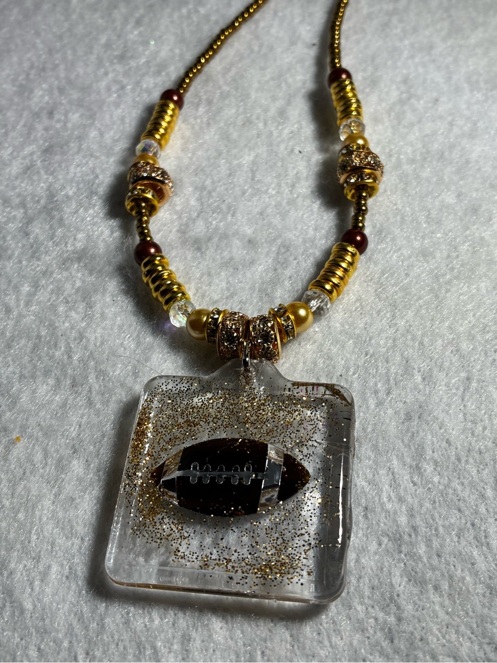 Gold and Brown Beaded football Necklace with Glitter resin